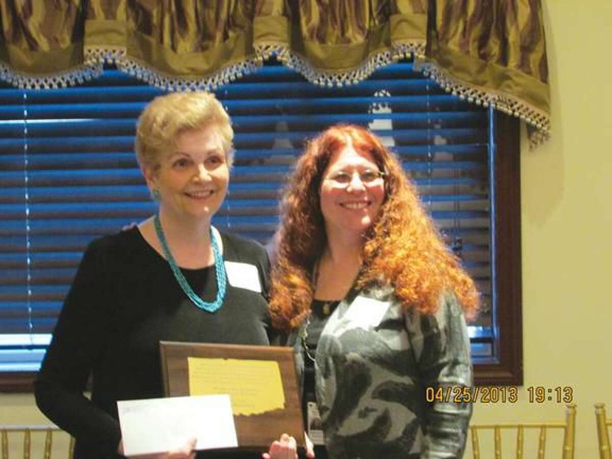 Submitted Photo Nancy Shwartz (right), Awards Chair of the Connecticut Association of School Librarians, presents the Bunny Yesner award to Mrs. Lydia Westerberg (left), library media specialist at Ridge Road School in North Haven, Connecticut.