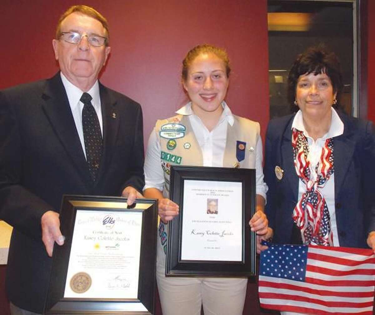 Submitted Photo Hamden Lodge President Alton Hudson presents award to local North Haven recipient Kasey Colette Jacobs, while Past President Karen Forsyth presents an American flag.