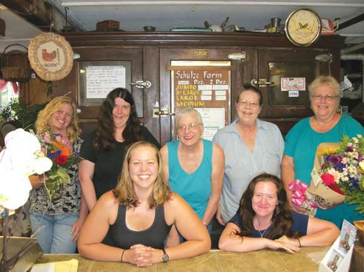 Photo by Lynn Fredricksen Flowers From the Farm, 1035 Sherman Ave., is a busy place where everyone works hard together. Front row, left to right: Michelle Bojarski and Darlene Ravid; standing, left to right: Kate Ambruso, Karen Wawock, Lauren Bojarski and Sharon Sivek. Missing from photo is driver Elizabeth Day who was on the road delivering flowers when the photo was taken.