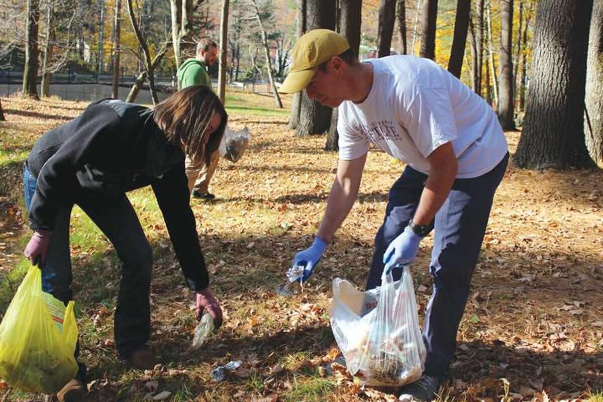 Submitted Photo Quinnipiac University School of Law students Rebecca Schlenker and Michael Tone of the Environmental Law Society picked up 30 pounds of trash Nov. 3 at Sleeping Giant State Park.