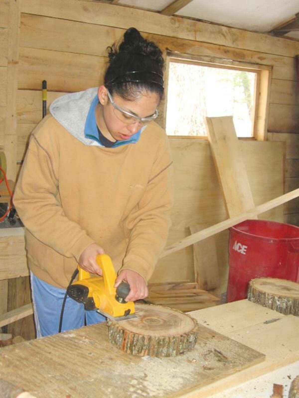 Submitted Photo Dannah Ortiz, a Quinnipiac University student, works at an Alternative Spring Break trip at the Camp Norwich YMCA of Northampton, Mass., the oldest YMCA Camp in the country.