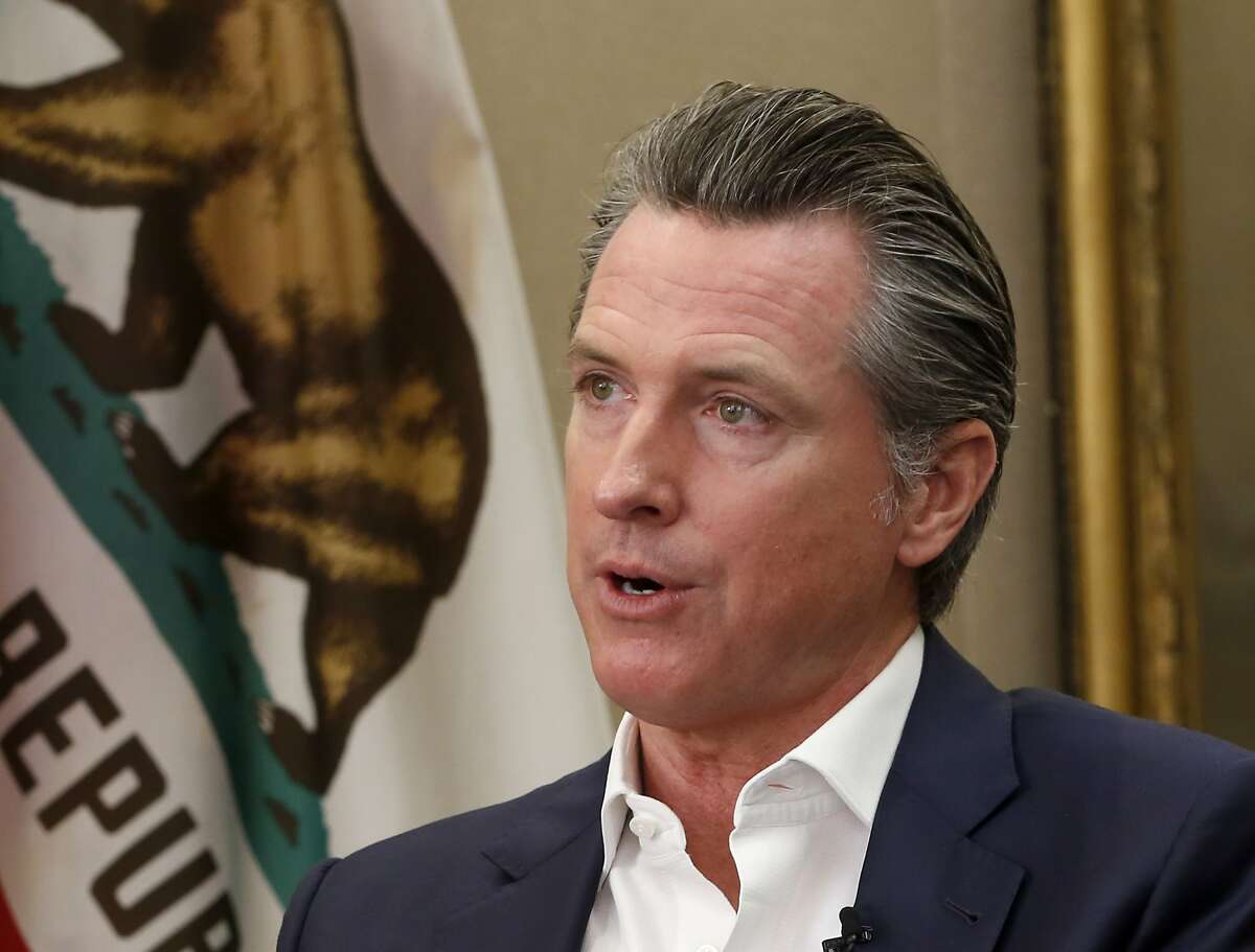Calling President Donald Trump "completely corrupt" California Gov. Gavin Newsom said Trump should be removed from office by Congress, during an interview in Sacramento, Calif., Tuesday, Oct. 8, 2019. But Newsom said that with Republicans in control of the U.S. Senate the best way to boot Trump from office is at the ballot box. (AP Photo/Rich Pedroncelli)