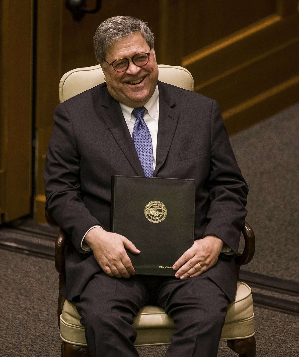 United States Attorney General William P. Barr laughs as he introduced for a speaking event for Notre Dame Law School students and faculty on Friday, Oct. 11, 2019, inside Notre Dame's Eck Hall of Law in South Bend, Ind. (Robert Franklin/South Bend Tribune via AP)