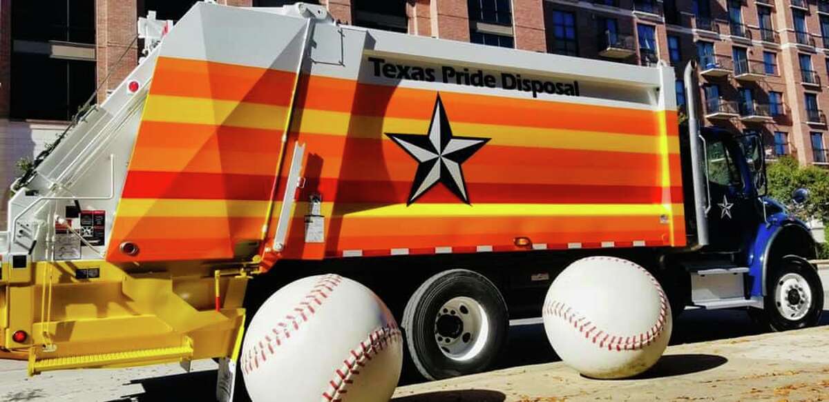 Texas Pride Disposal decorates one of their Houston garbage trucks ahead of the Astros' game on Tuesday.
