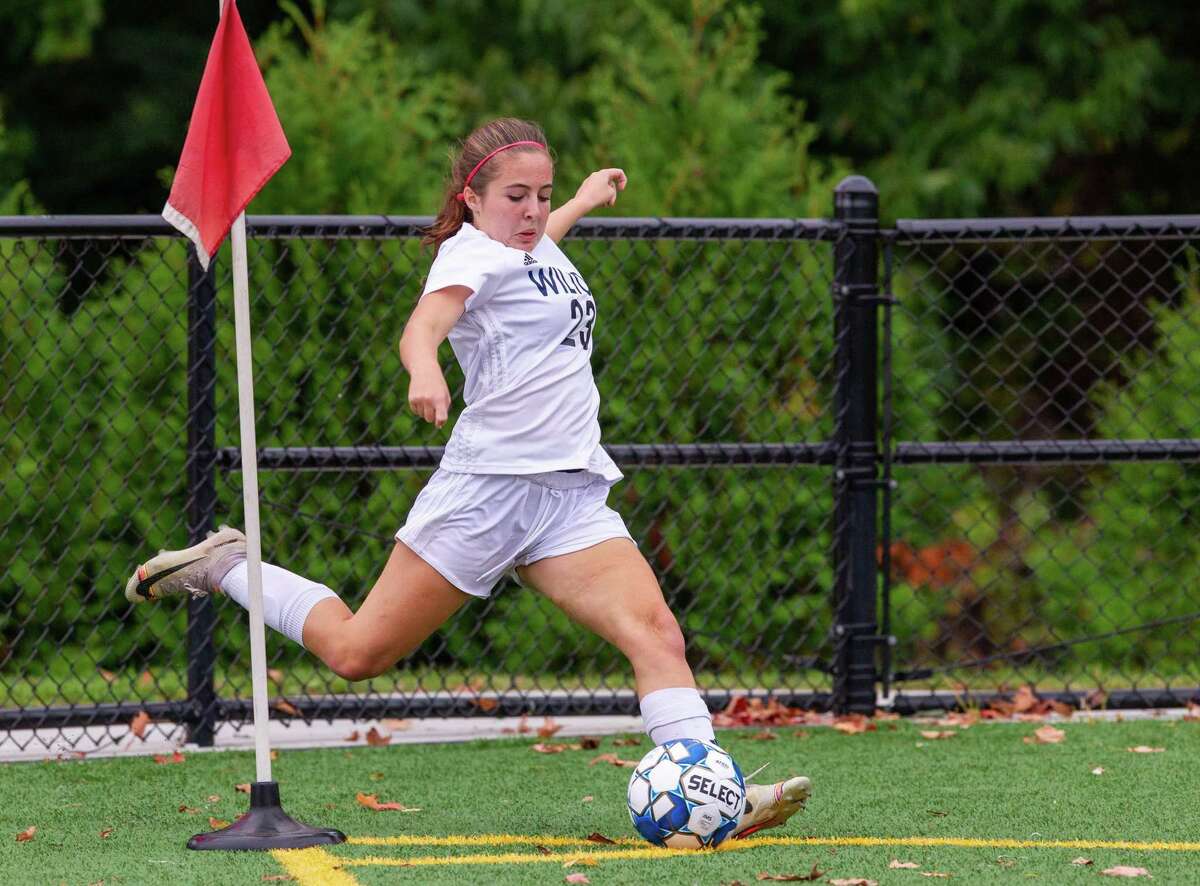 Mia Pepitone delivers a corner kick during a recent Wilton girls soccer game.