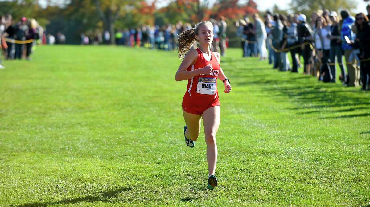 Greenwich’s Mari Noble heads to the finish line at the FCIAC Cross Country championship on Tuesday. Noble won the title by nearly 30 seconds.