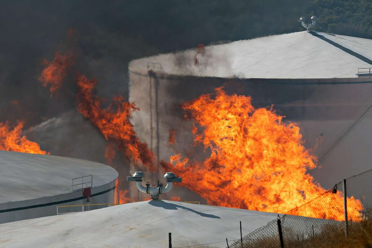 Flames engulf the NuStar energy facility after reports of an explosion in Crockett, Calif. on Tuesday, Oct. 15, 2019.