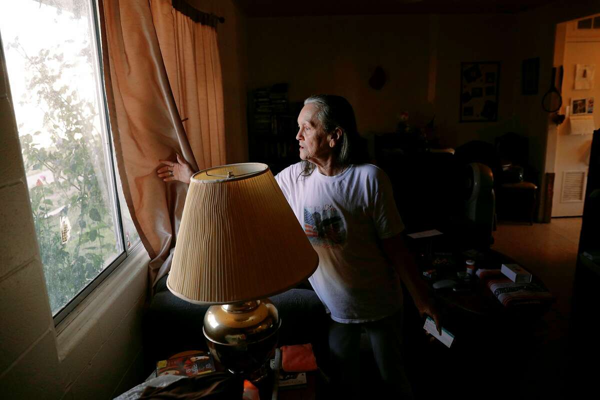 Kathy Reed of Tulibee Court in Rodeo stand inside her living room where she is sheltered in place place for several hours after an explosion and fire at the new star energy facility in Crocket calif., on Tuesday, October 15, 2019