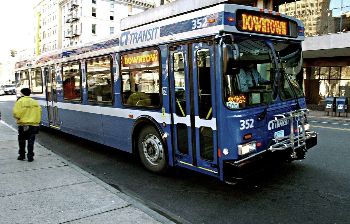 CITBUS-12/30/03-Mia New busses have hit the streets of new Haven. Sporting a bright blue coat of paint, and bike racks on the front, approx. 20 of these buses have made their debut. Phoot by Mia M Malafronte file;mIa0109d(1398)