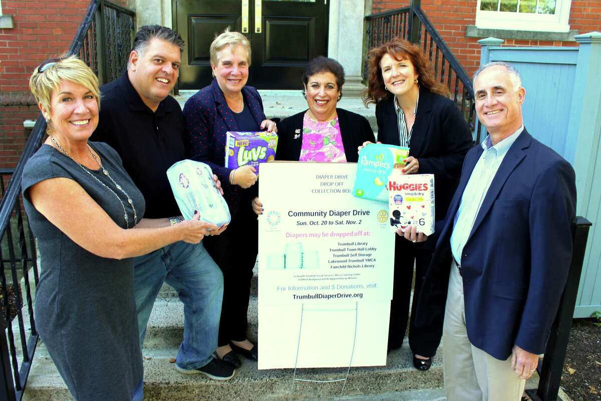 State Representatives Laura Devlin and David Rutigliano, Trumbull’s First Selectman Vicky Tesoro, Beth Stoller from Trumbull Rotary, Janine Wolfe from Trumbull Community Women and Vincent Fini from Trumbull Rotary with their donations of diapers.