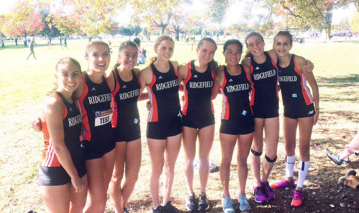 The Ridgefield girls cross country team after winning the FCIAC championship Tuesday at Waveny Park in New Canaan.