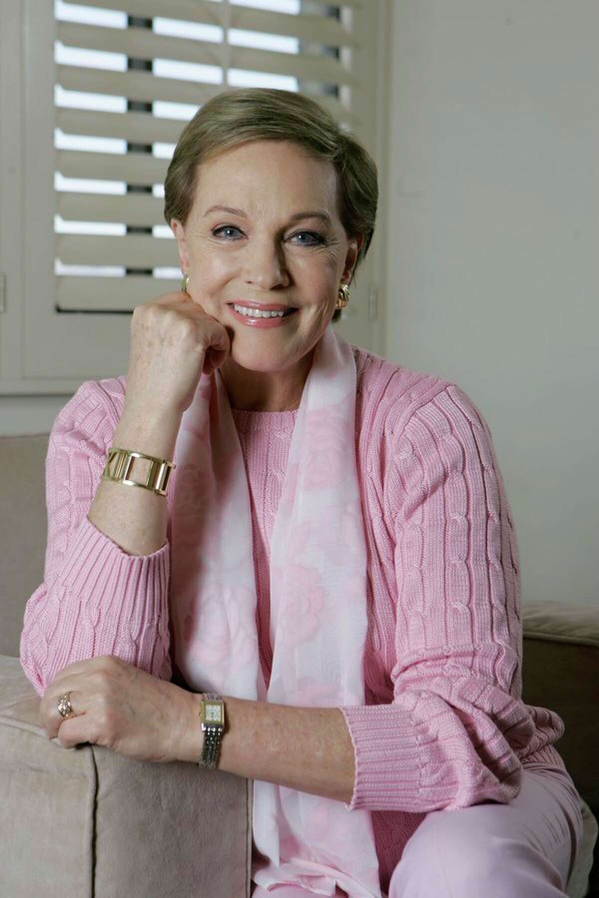 FILE - This May 5, 2007 file photo shows actress and singer Julie Andrews poses in Los Angeles. Andrews released a memoir, "Home Work: A Memoir of My Hollywood Years," which hits shelves on Oct. 15, 2019. (AP Photo/Chris Carlson, File)