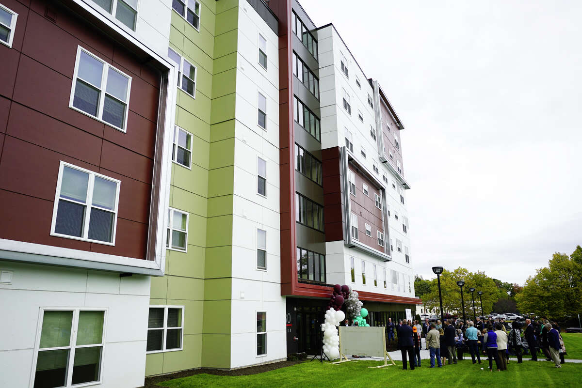 People gather for a ribbon cutting event for affordable housing at 280 North on Wednesday, Oct. 16, 2019, in Albany, N.Y. 280 North is the second phase of the redevelopment of the site where Ida Yarbrough Homes once stood. (Paul Buckowski/Times Union)