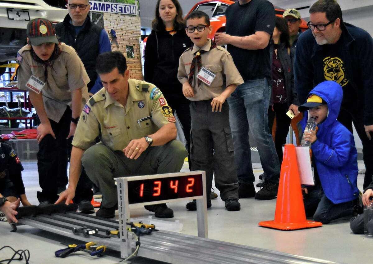 Adults to race Pinewood Derby cars at Miller Motorcars in Greenwich