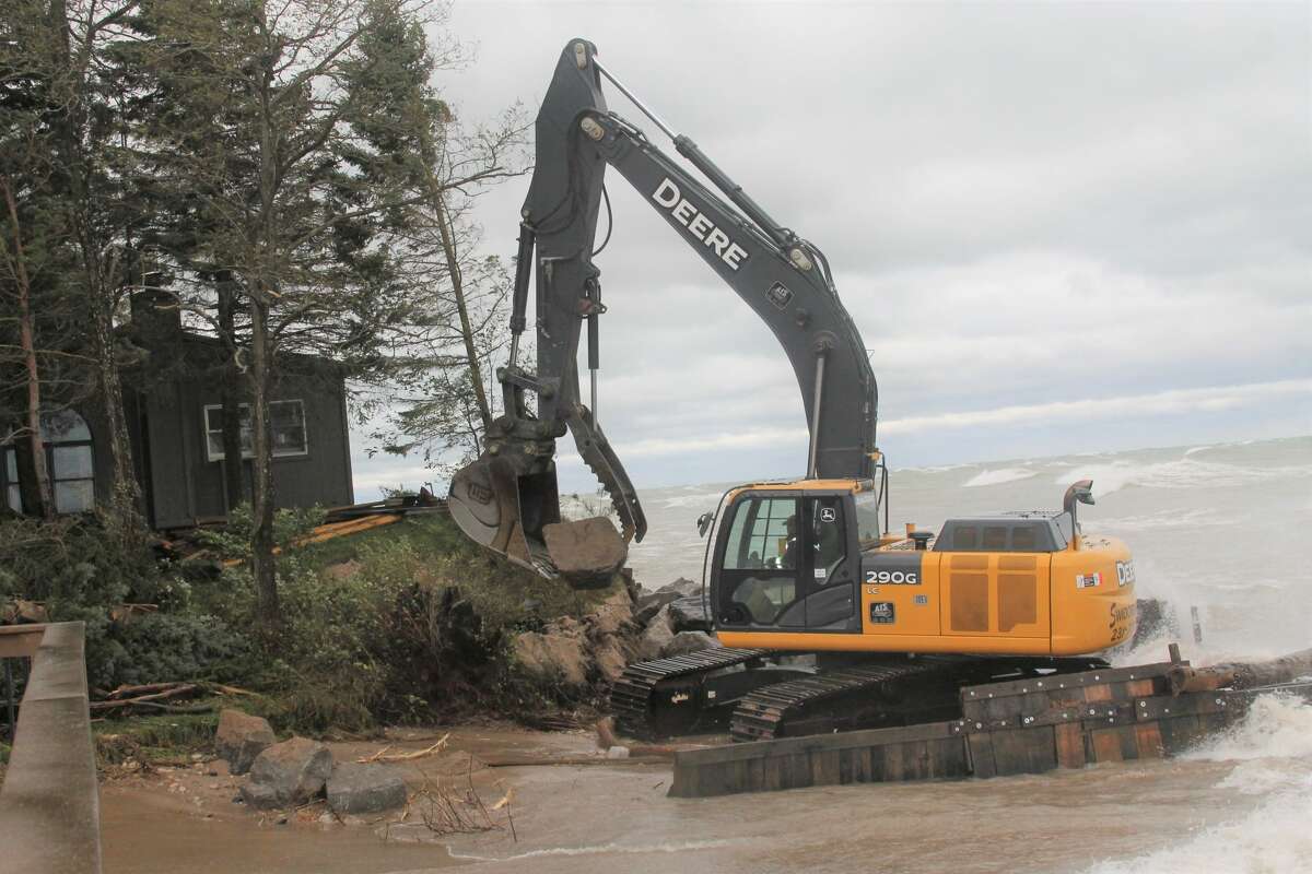 Swidorski Bros. Excavating's equipment works on fortifying the shoreline home owned by Rochelle Radlinski on Lakeshore Road on Oct. 16, 2019 by placing large rocks to protect it from washing into Lake Michigan. 