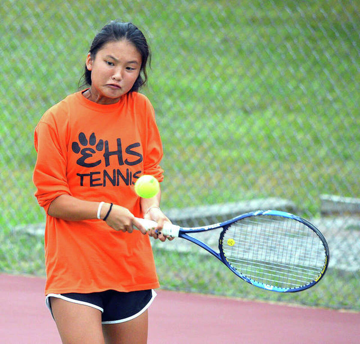 Edwardsville freshman Chloe Koons hits a two-handed backhand during her No. 2 doubles match on Tuesday in the Southwestern Conference Tournament at the EHS Tennis Center.