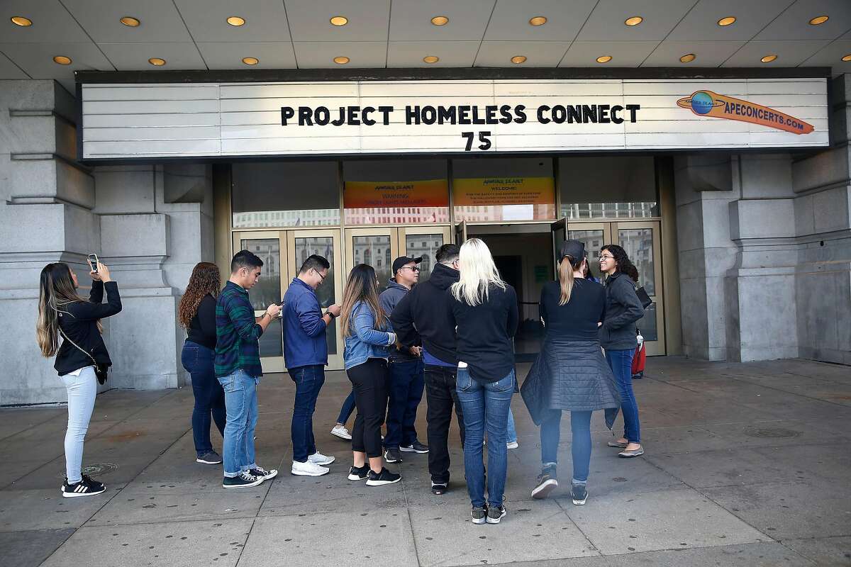 California State University, East Bay senior nursing program students gather in front of the Bill Graham Civic Auditorium to volunteer at Project Homeless Connect on Wednesday, October 16, 2019 in San Francisco, Calif.