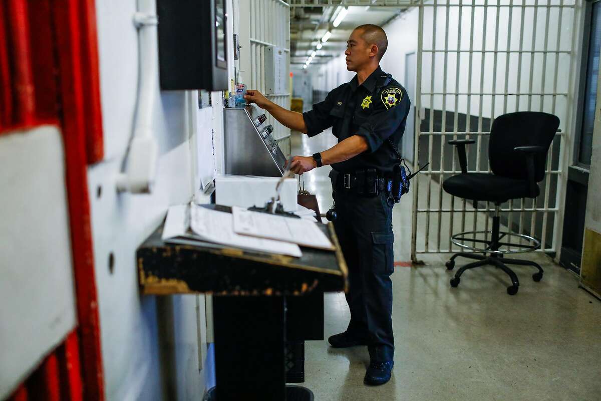 A sheriff monitors County Jail 4 in the Hall of Justice in San Francisco, California, on Thursday, Nov. 1, 2018.