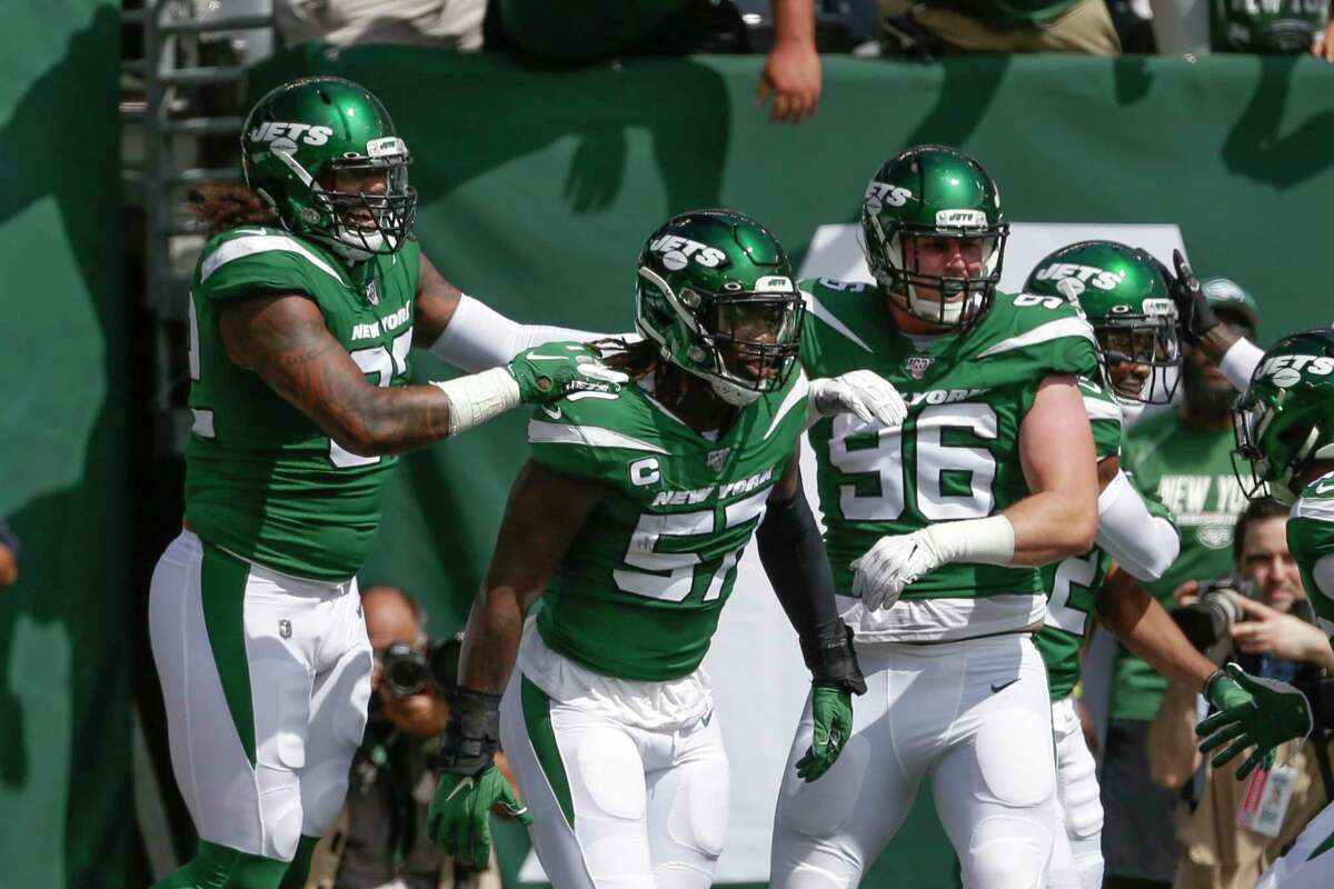 New York Jets inside linebacker C.J. Mosley (57) celebrates with teammates after running back an interception for a touchdown during the first half of an NFL football game against the Buffalo Bills Sunday, Sept. 8, 2019, in East Rutherford, N.J. (AP Photo/Seth Wenig)