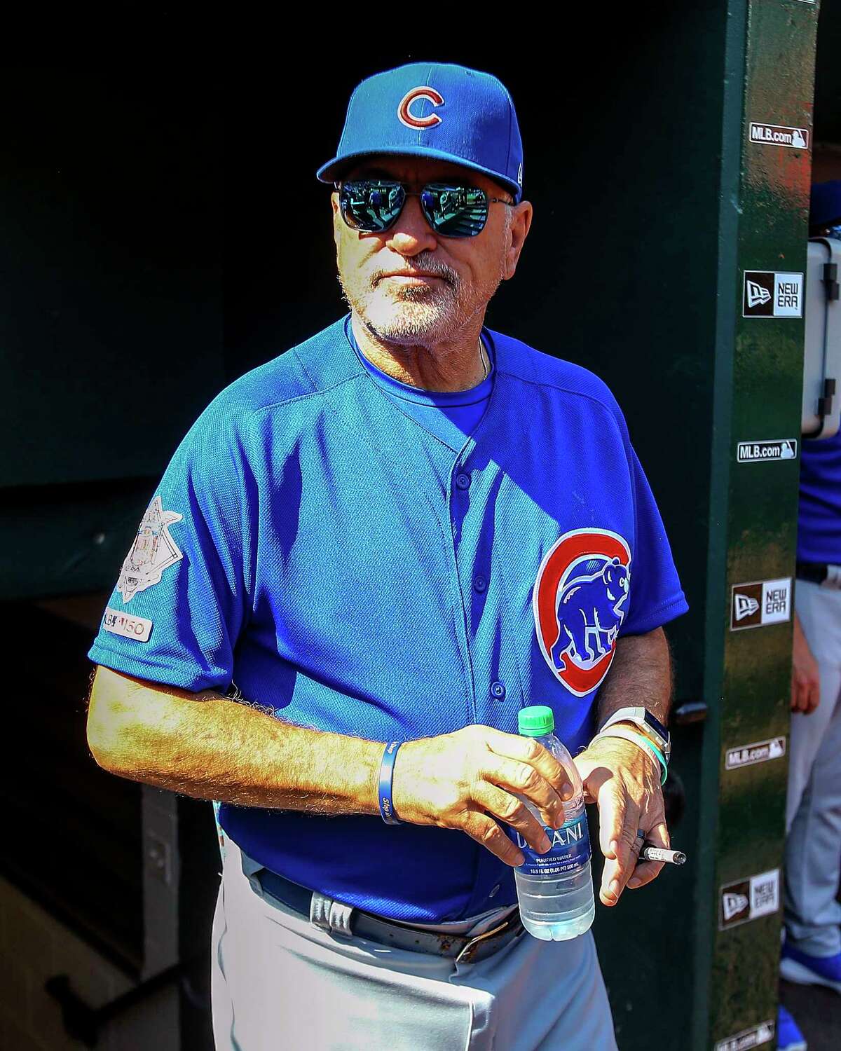 Chicago Cubs manager Joe Maddon looks out from the dugout prior to a baseball game against the St. Louis Cardinals, Sunday, Sept. 29, 2019, in St. Louis. (AP Photo/Scott Kane)