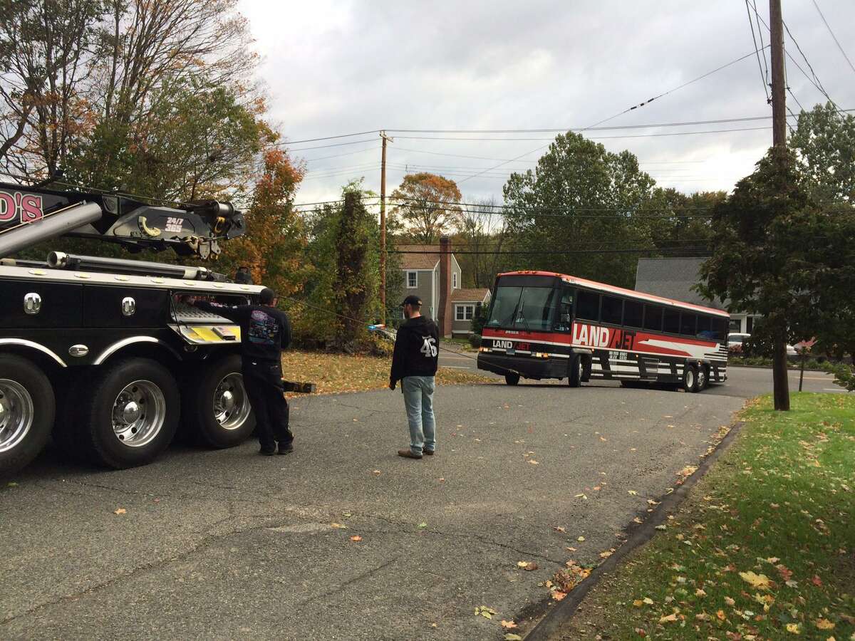 A coach bus on its way to pick up students at St. Theresa School for a field trip got stuck Thursday morning when it could not make the turn onto Rosemond Terrace. The trip had already been canceled due to the delayed opening, but the driver said he had left Waterbury at 7 a.m. and had not been informed the trip was off.