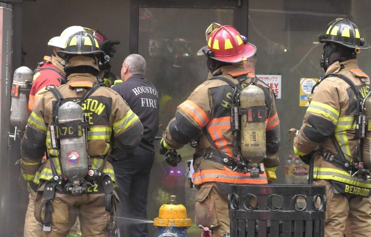 Firefighters douse 'stubborn' fire inside downtown Houston corner store