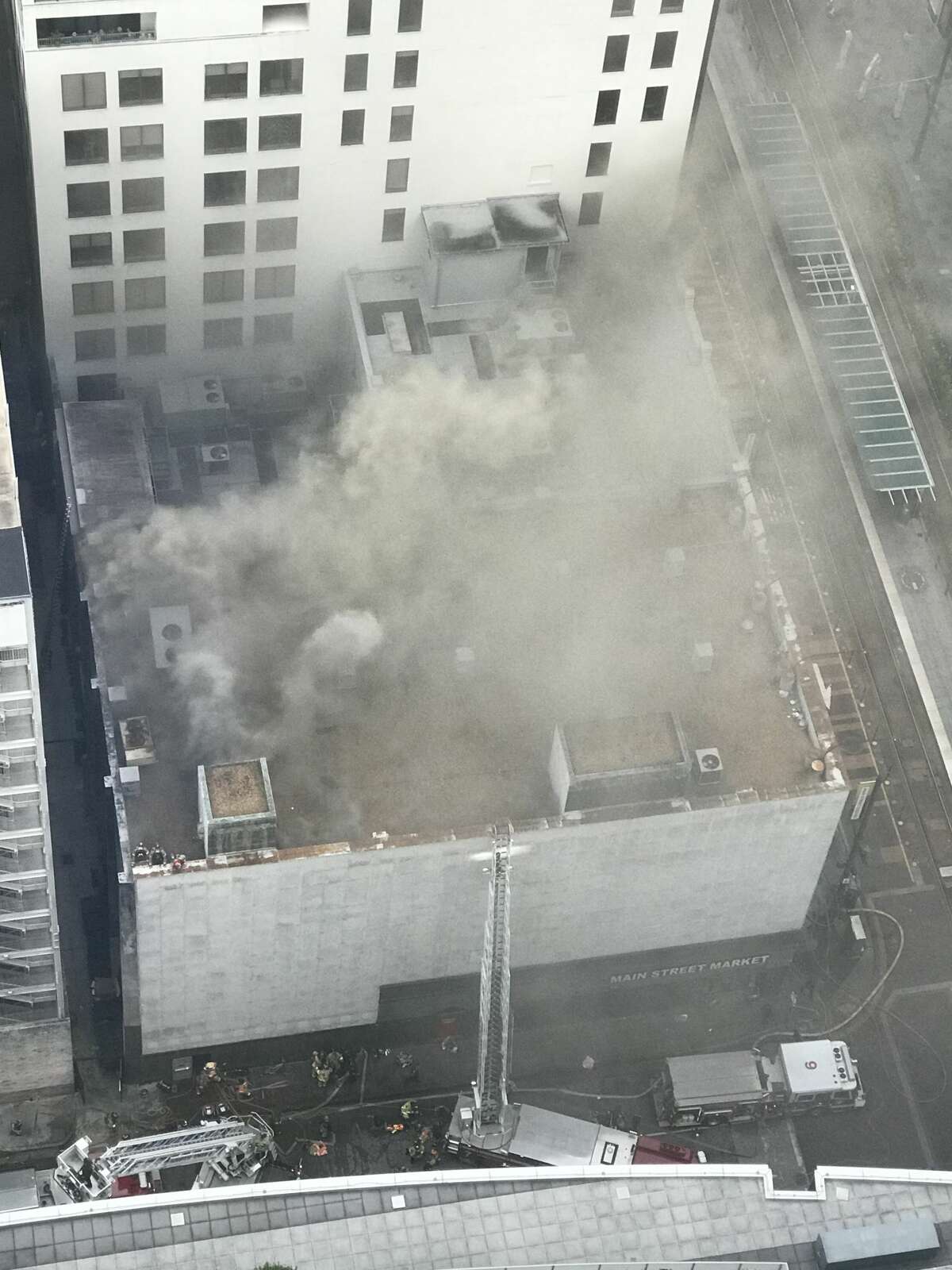 Firefighters douse 'stubborn' fire inside downtown Houston corner store