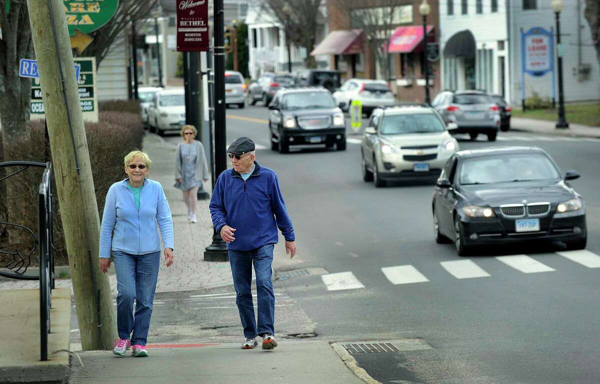 Betty and Don Campbell of Bethel take a walk on Greenwood Avenue in Bethel Thursday, March 17, 2016.
