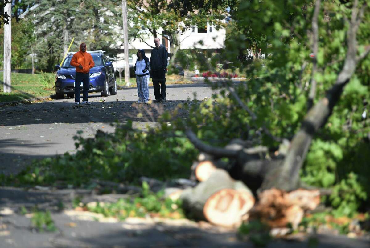 A tree fallen across powerlines blocks dead end West Shore Drive in Milford, Conn. on Wednesday, October 16, 2019.