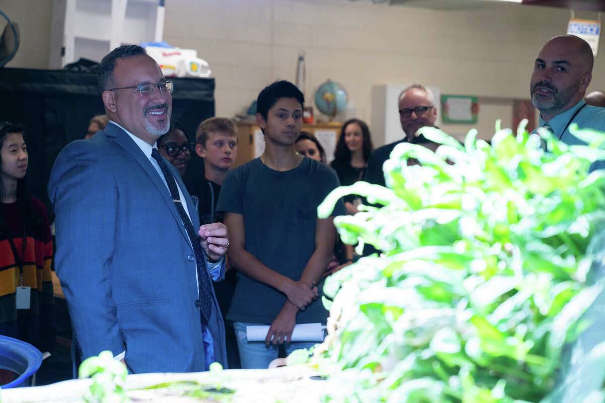 CT Commissioner of Education Miguel Cardona inspects the greenhouse in the SIS School of Innovation.