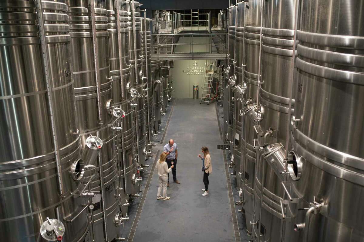 Winemakers taste rose in the production facility of the Chateau Sainte Roseline in the southern France region of Provence Friday Oct. 11, 2019. European producers of premium specialty agricultural products like French wine, Italian Parmesan and Spanish olives are facing Fridayas U.S. tariff hike with a mix of trepidation and indignation at being dragged into a trade war over the fiercely competitive aerospace industry.(AP Photo/Daniel Cole)