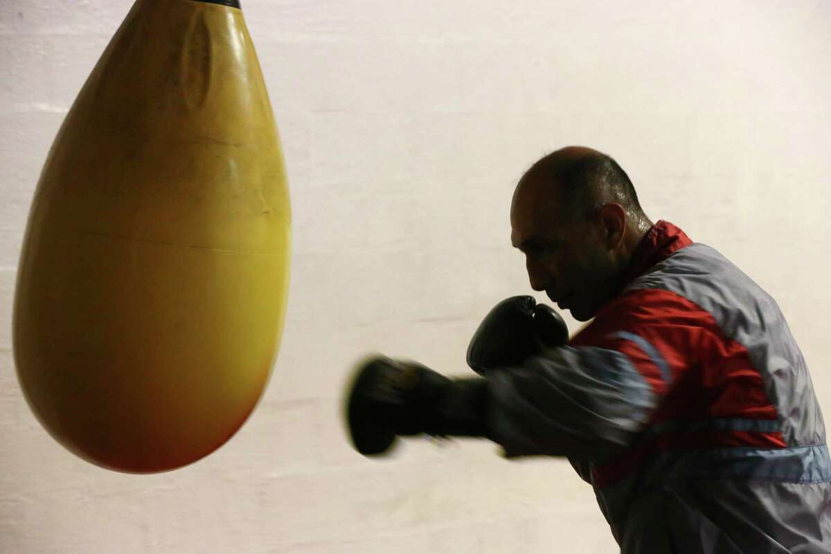 John Michael Johnson, 51, trains at TMB Morones Boxing Gym on Nogalitos Street, Wednesday, Oct. 16, 2019. Johnson, a three-time world boxing champion, is coming out of retirement and attempting a comeback by returning to the ring in a Nov. 16 fight against Omar Castillo, 23, of San Juan, Texas.