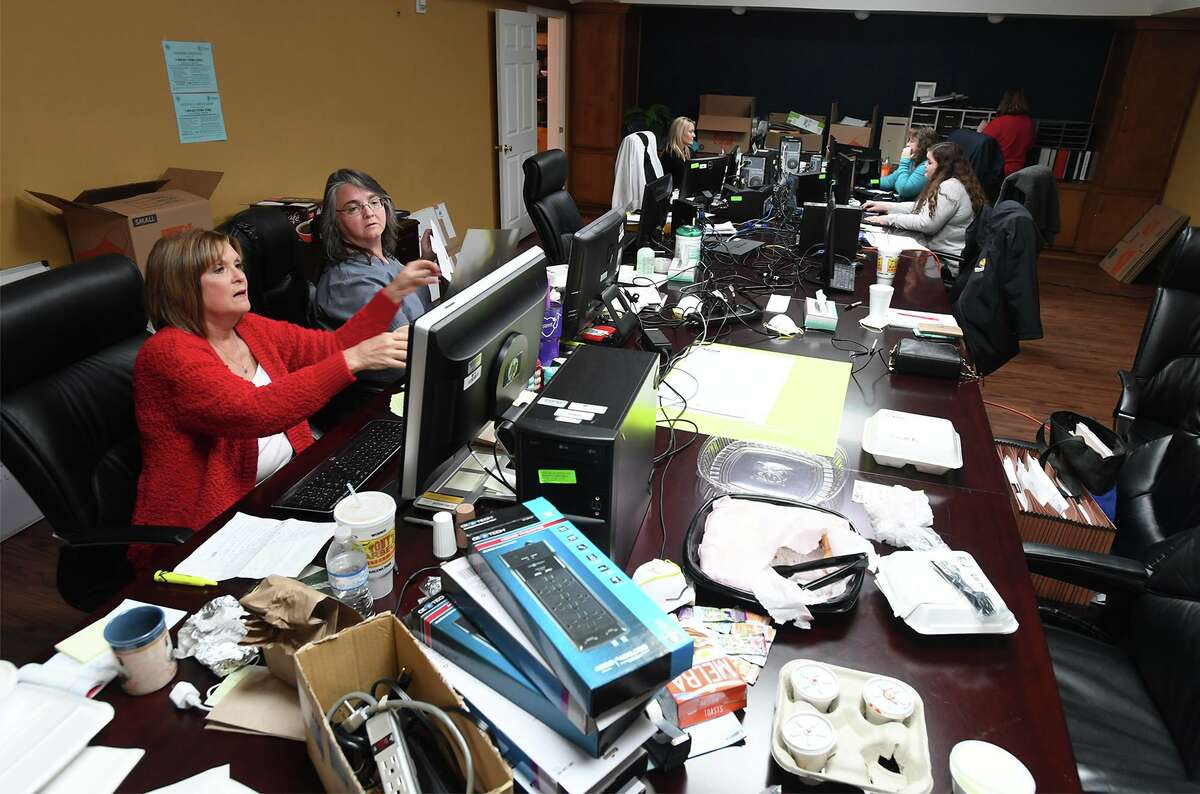 Hospital staff works in a make shift office at Riceland Medical Center in Winnie Thursday. While patients are being seen in the facility's clinic, the hospital section has been closed since Tropical Depression Imelda flooded the area. Administrators expect to return to regular operations within a few weeks. Photo taken Thursday, 10/17/19