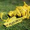 (FILES) In this file photo taken on August 8, 2019 a bundle of police crime scene tape is left on front of the 7-eleven shop in Santa Ana, California where a security guard was fatally stabbed. - Violent crime in the United States fell for a second straight year in 2018, underscoring a long-term downward trend that was briefly interrupted by an uptick in 2015 and 2016, the FBI said on September 30, 2019. The Federal Bureau of Investigation said there were some 1.2 million violent crimes in 2018, down 3.3 percent from the year before. Homicides were down 6.2 percent from 2017, with 16,214 murders, almost three quarters of which were committed with a firearm. (Photo by Apu Gomes / AFP)APU GOMES/AFP/Getty Images