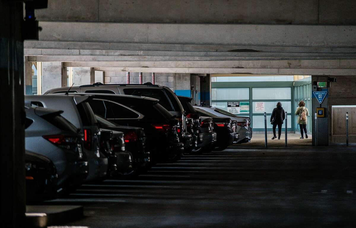 People exit the parking structure at the BART Millbrae Station in Millbrae, Calif. on Thursday, October 16, 2019. BART is preparing to launch an ambitious plan which will see much of the transit agency's dedicated parking lots shrunken or eliminated to become sites of high-density housing.