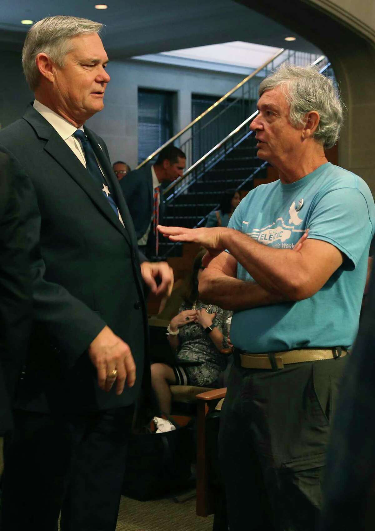 Climate Action and Adaptation Plan supporter Alan Montemayor, right, speaks with San Antonio City Council District 10 member Clayton Perry before the start of the council’s regular meeting, Thursday, Oct. 17, 2019. The council voted 10-1 to pass the plan. Perry was the lone vote against it.