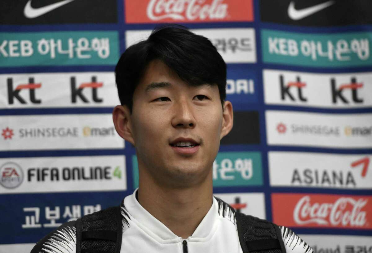 South Korean footballer Son Heung-min speaks to the media upon his arrival at Incheon airport in Incheon early on October 17, 2019 after the World Cup 2022 Qualifying Asian zone Group H football match between South Korea and North Korea which held at Kim Il Sung Stadium in Pyongyang. - FIFA president Gianni Infantino said he was "disappointed" after attending a historic but bizarre World Cup qualifier between North and South Korea that had empty stands and no live broadcast. The rare match in the North Korean capital ended 0-0 on October 15, with Infantino one of the few people allowed to see the surreal game play out at Pyongyang's Kim Il Sung Stadium. (Photo by Jung Yeon-je / AFP) (Photo by JUNG YEON-JE/AFP via Getty Images)