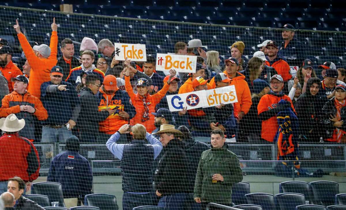 Houston Astros fans celebrate after the Astros defeated the New York Yankees 8-3 in Game 4 of the American League Championship Series at Yankee Stadium on Thursday, Oct. 17, 2019, in New York.