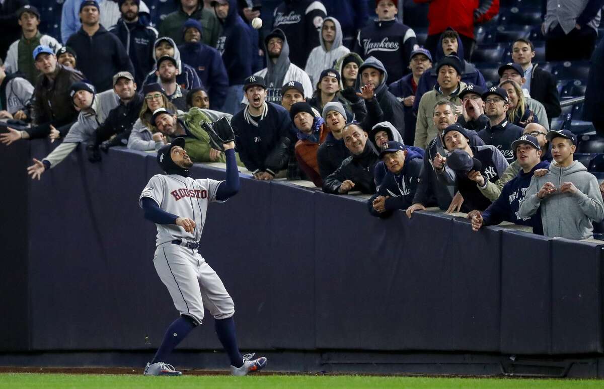 Houston Astros right fielder George Springer (4) catches a ball hit by New York Yankees second baseman Gleyber Torres to end Game 4 of the American League Championship Series at Yankee Stadium on Thursday, Oct. 17, 2019, in New York. The Astros won 8-3, taking a 3-1 lead in the series.