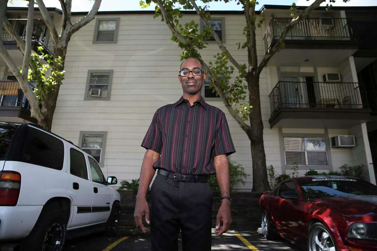 Michael Washington, 48, has lived at the Soap Factory apartment complex at 500 N. Santa Rosa St. for more than a decade. The property's Houston-based owners have been raising residents' rents since they bought the complex in 2017. Washington said he can afford the increases for now but that rising rents will probably force him out within the next two to three years. (Kin Man Hui/San Antonio Express-News)