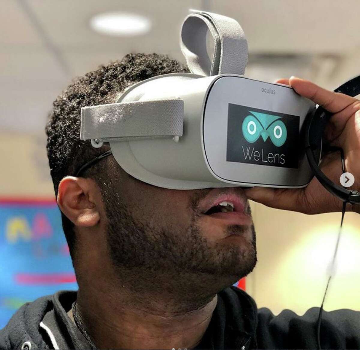 A Ridgefield Independent Film Festival attendee tries on a virtual reality headset.