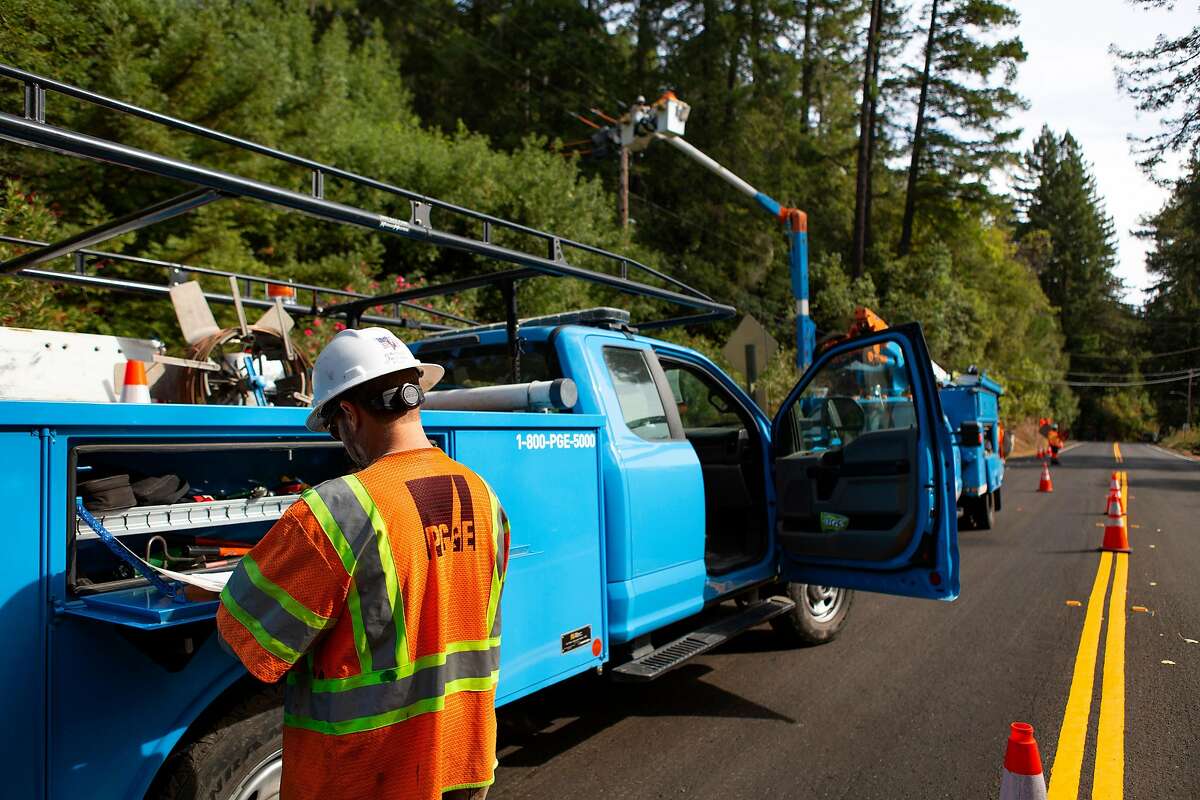 PG&E construction workers work on the power lines off Armstrong Woods Rd in Guerneville, Ca on Wednesday October 16, 2019.