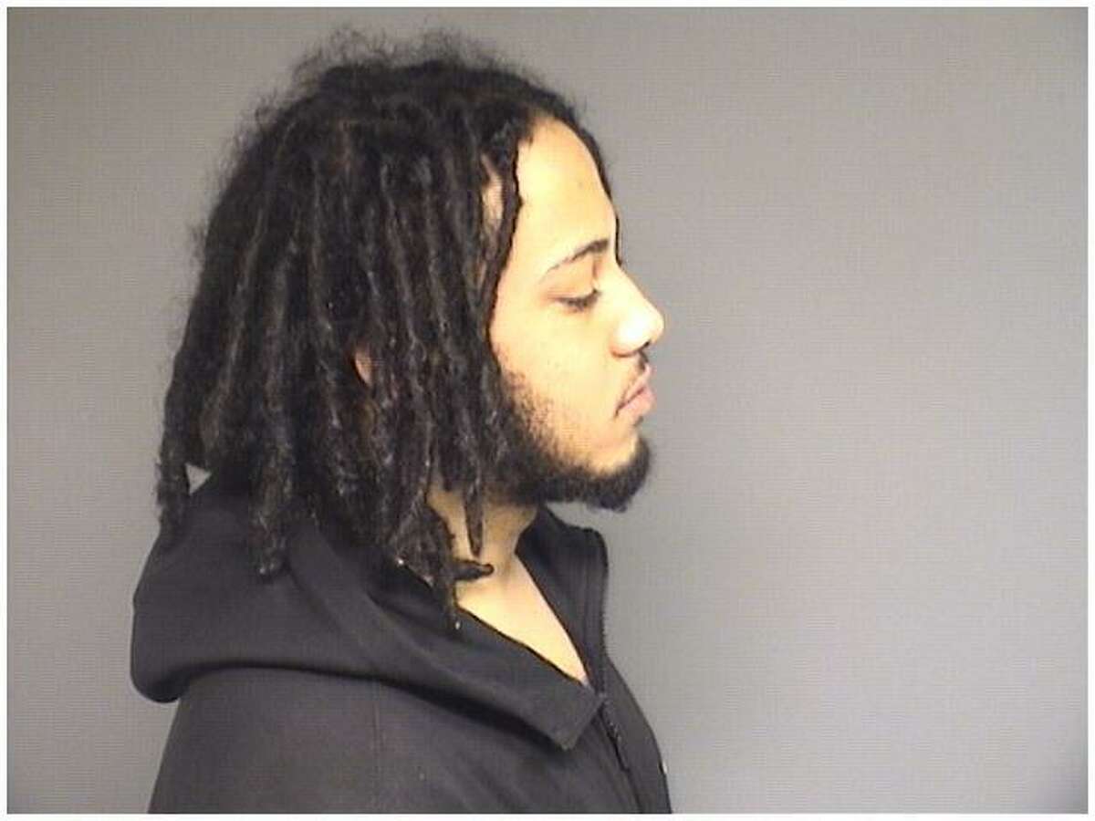 Dashawn Johnson, 23, of Ansonia, was charged wtih possession of a handgun by a felon, possession of 50 folds or heroin, stealing a firearm and stealing a car.