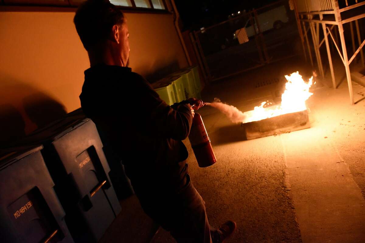 Joe Richards practices using a fire extinguisher during a San Francisco Fire Department's NERT (Neighborhood Emergency Response Team) training class on September 26, 2019 in San Francisco, Calif.