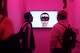 Visiting students from English Language Institue SF watch an Ashley Madison Angels at Work in San Francisco exhibition in a secret room of �The Glass Room�, a new pop-up exhibition which just opened on Wednesday, Oct. 16, 2019, in San Francisco, Calif.