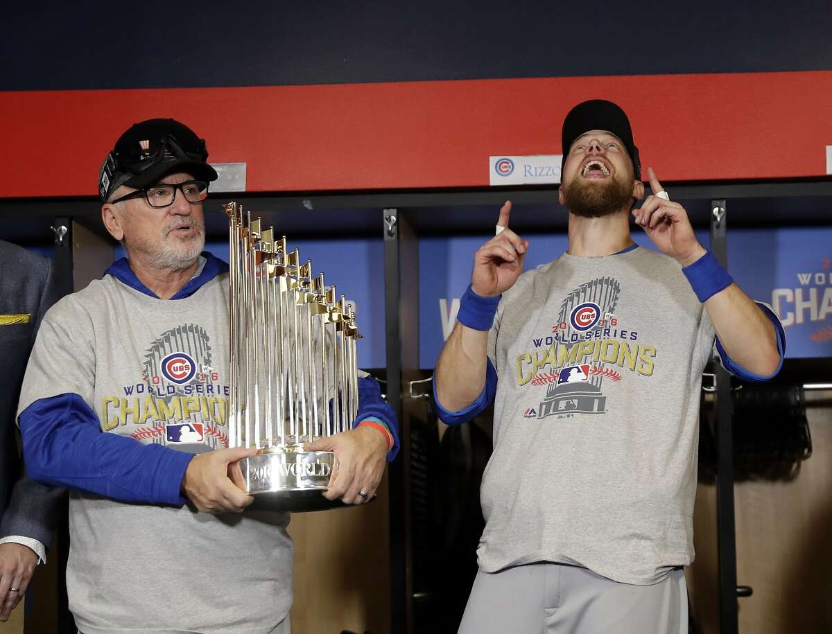 FILE - In this Nov. 3, 2016, file photo, Chicago Cubs manager Joe Maddon, left, and Ben Zobrist celebrate after Game 7 of the Major League Baseball World Series against the Cleveland Indians, in Cleveland. Maddon has agreed to become the Los Angeles Angels' manager. Maddon and the Angels agreed to terms Wednesday, Oct. 16, 2019, on a deal to reunite the veteran manager with the organization where he spent the first three decades of his baseball career. (AP Photo/David J. Phillip, File)