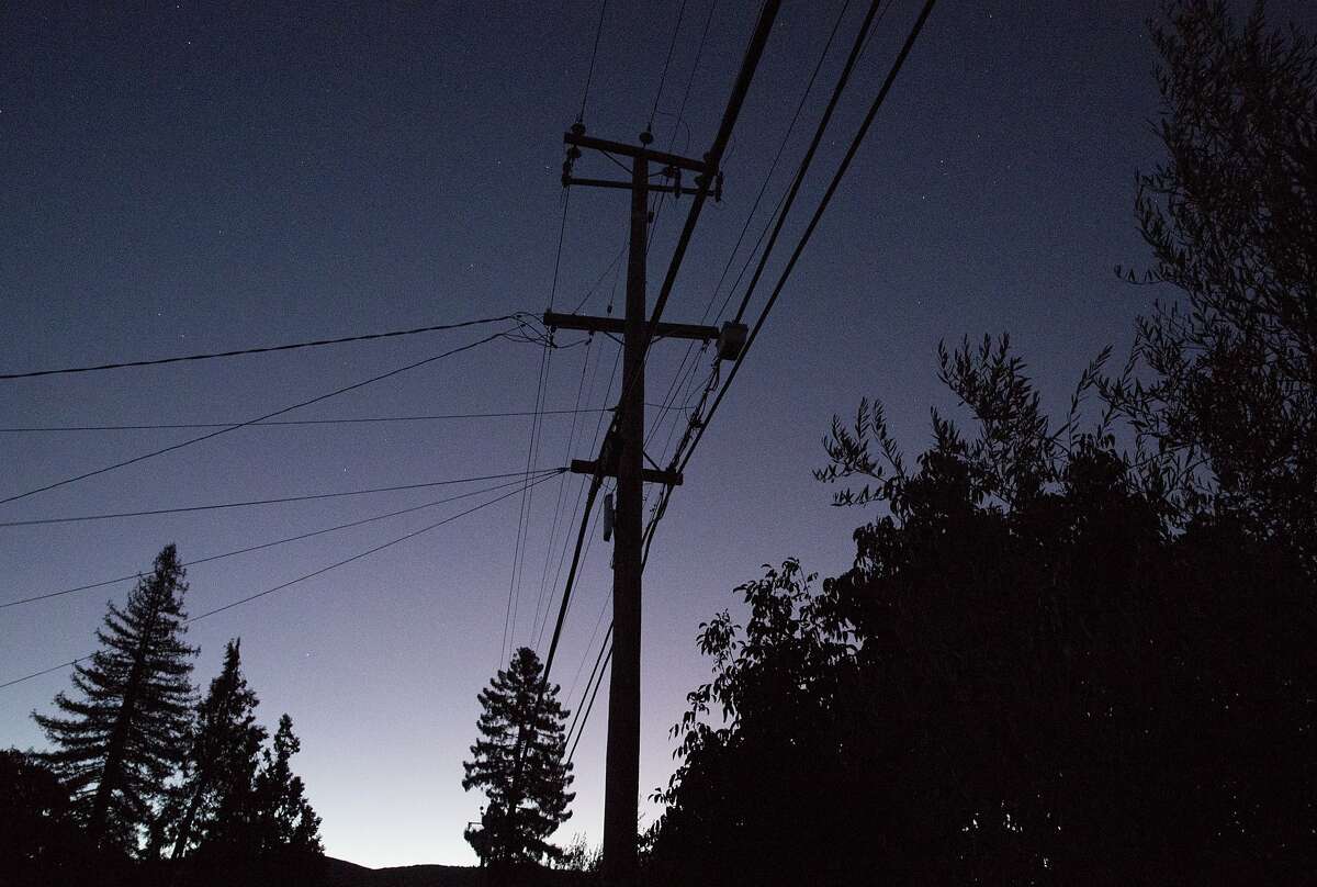 Power lines are seen against an early sunrise sky in Napa, Calif. Thursday, Oct. 10, 2019 due to a PG&E Public Safety Power Shutoffs across Northern California.