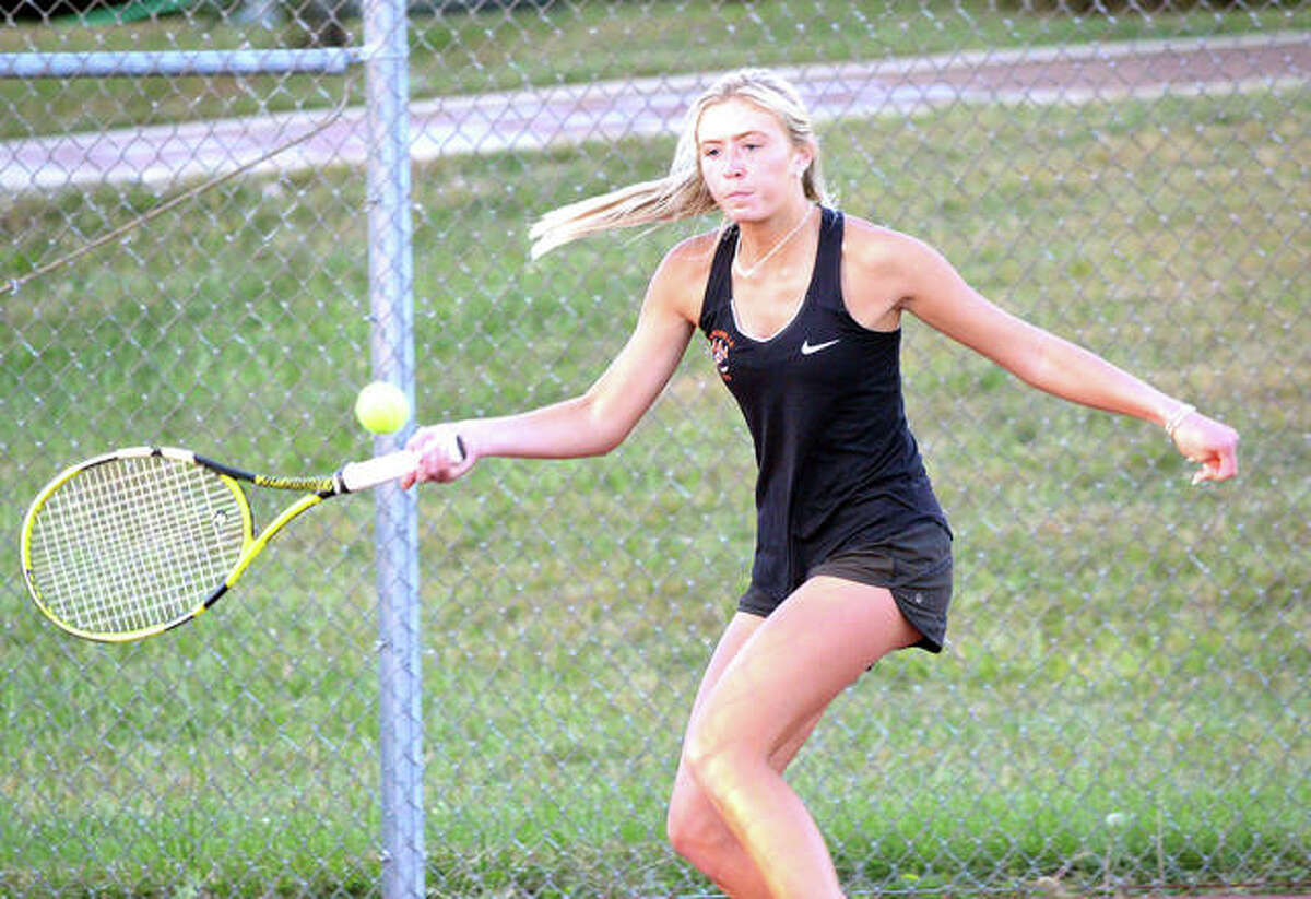 Edwardsville junior Emma Herman makes a forehand return on Friday during her doubles quarterfinal match in the Class 2A Edwardsville Sectional at the EHS Tennis Center.