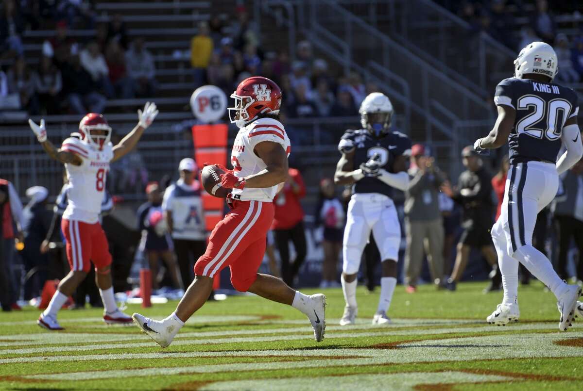 Houston running back Kyle Porter (22) scores during the first half of an NCAA college football game against Connecticut, Saturday, Oct. 19, 2019, in East Hartford, Conn. (AP Photo/Stephen Dunn)