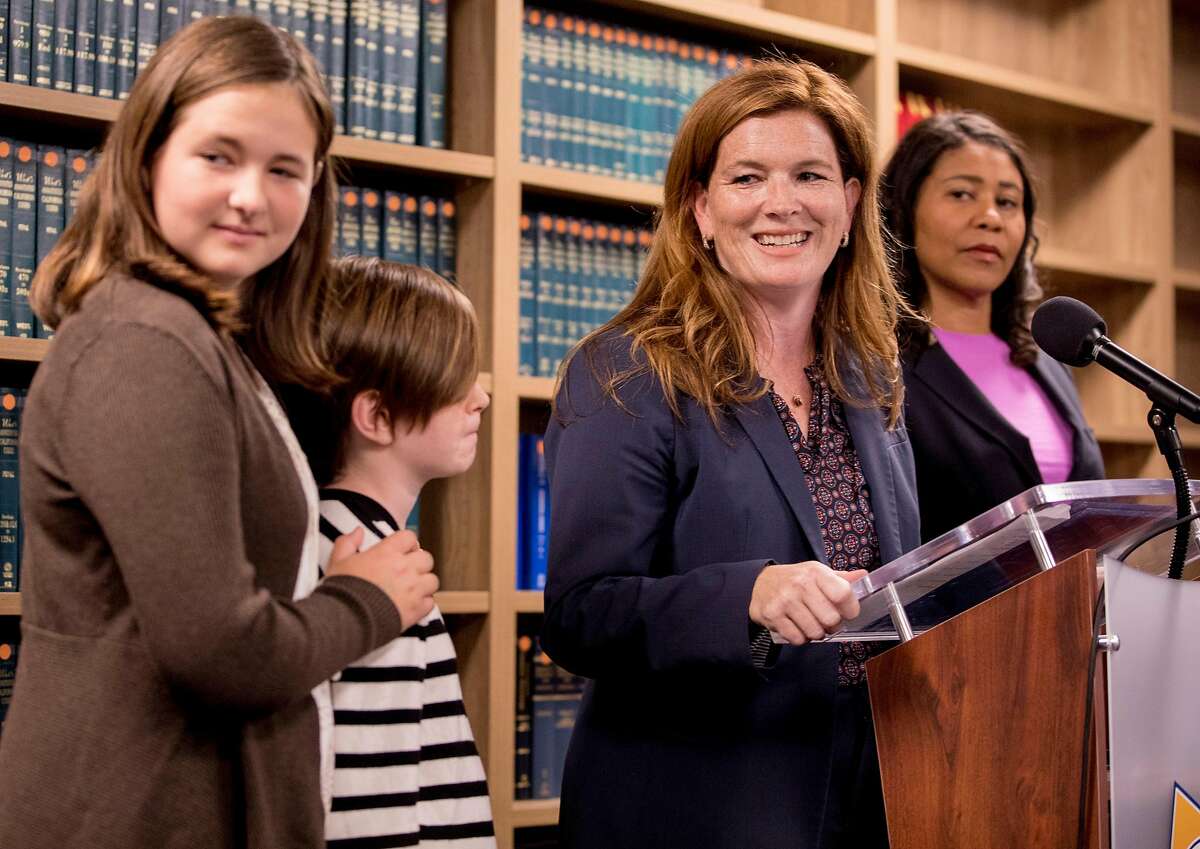 San Francisco District Attorney candidate Suzy Loftus looks over at her family after being sworn in as interim San Francisco District Attorney by Mayor London Breed at the District Attorney's office in San Francisco, Calif. Saturday, Oct. 19, 2019.